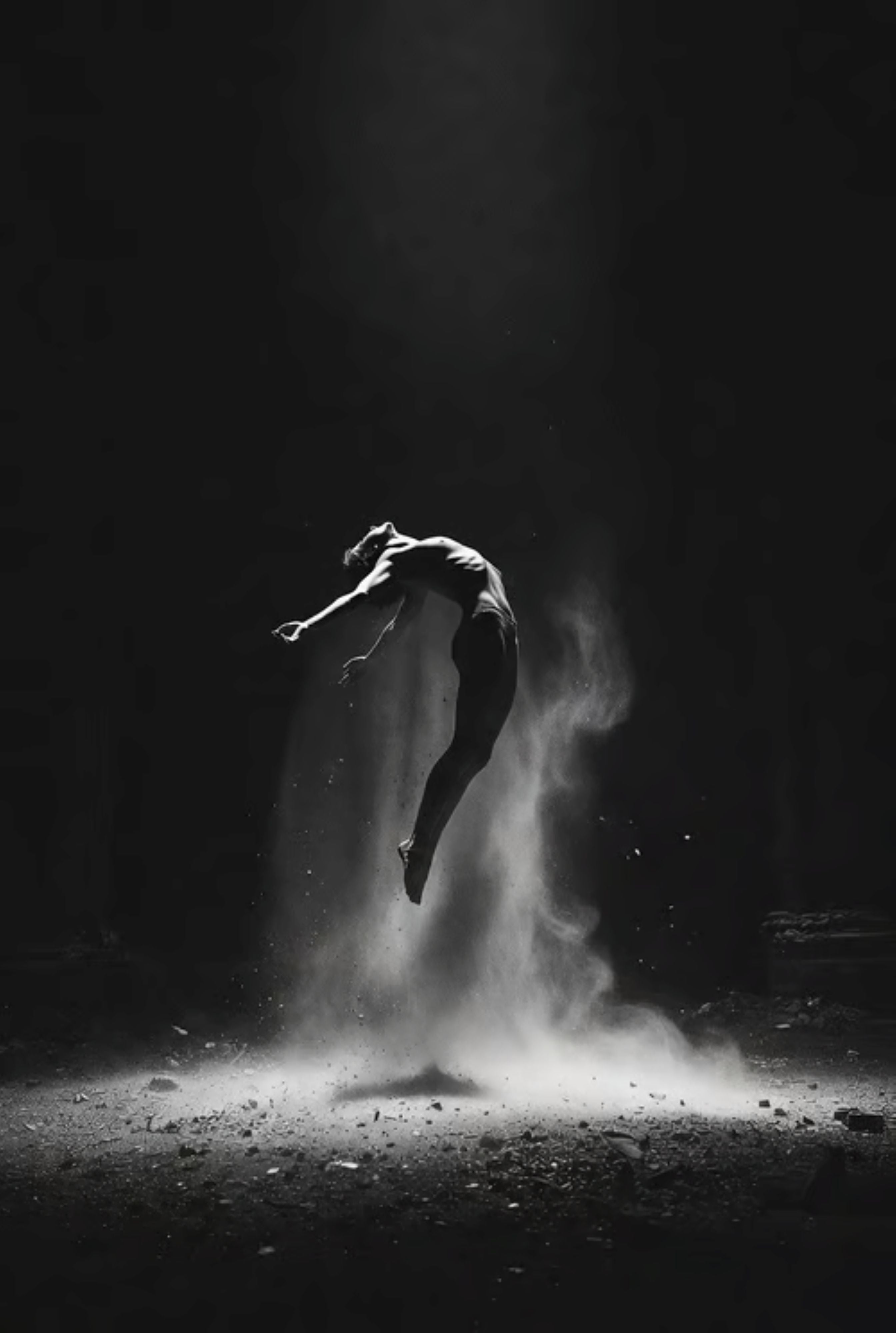Dancer in a dark setting with dust or sand around