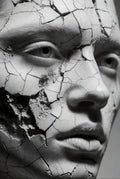 Artistic depiction of a face with a cracked, textured surface
