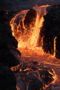 Molten lava flowing over rocks with a dark background