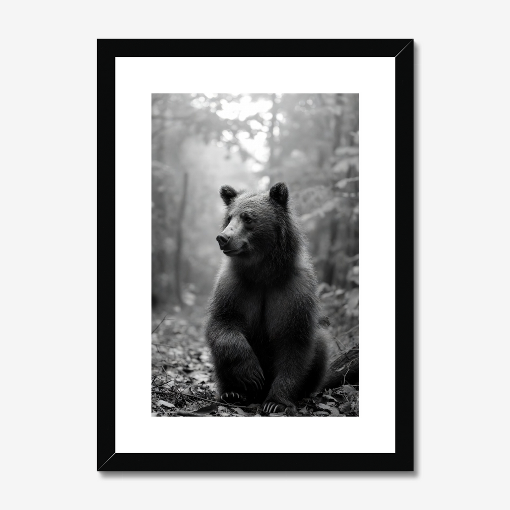 Framed black and white print of a bear in a forest setting