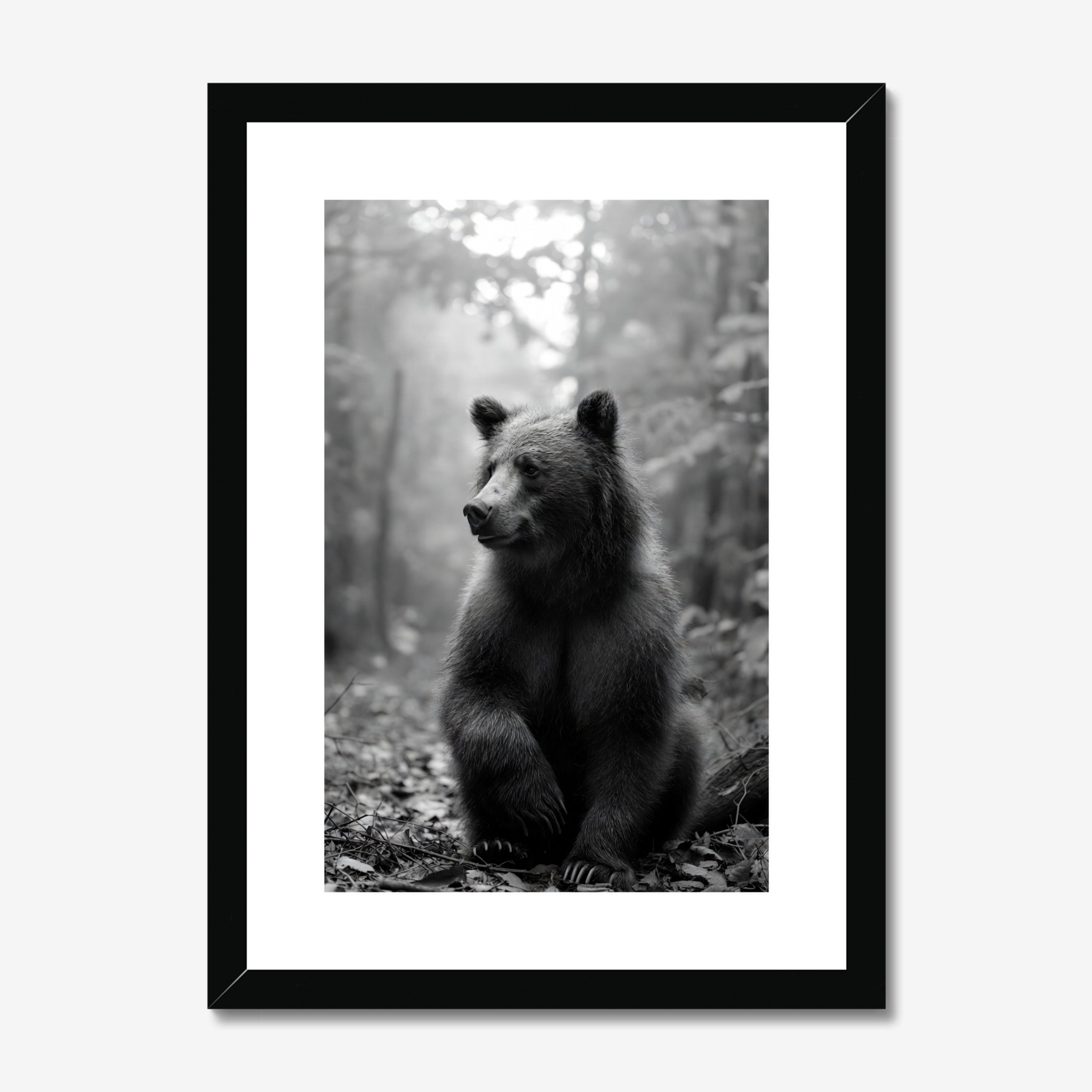Framed black and white print of a bear in a forest setting
